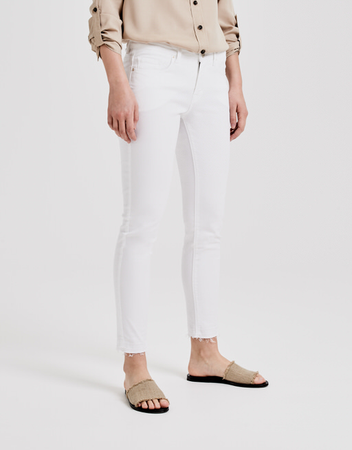 white stretch trousers